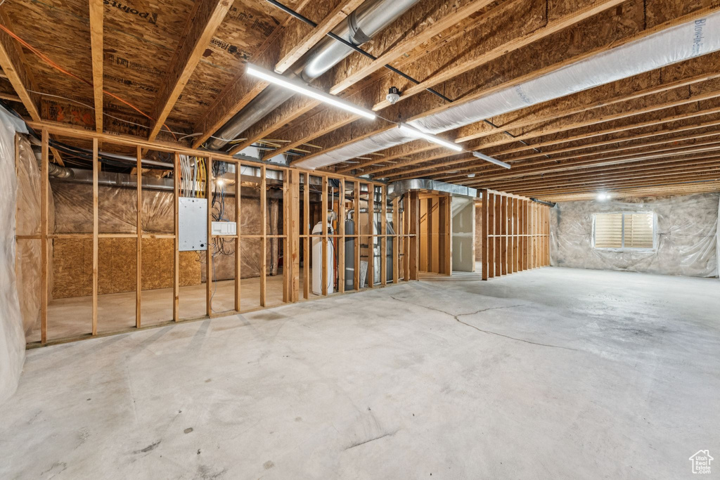 Unfinished below grade area featuring electric panel