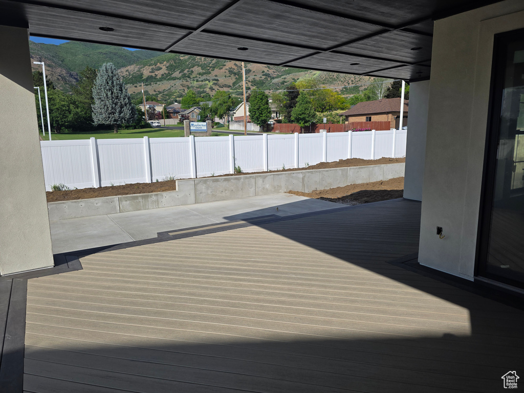 Deck featuring a mountain view and a patio