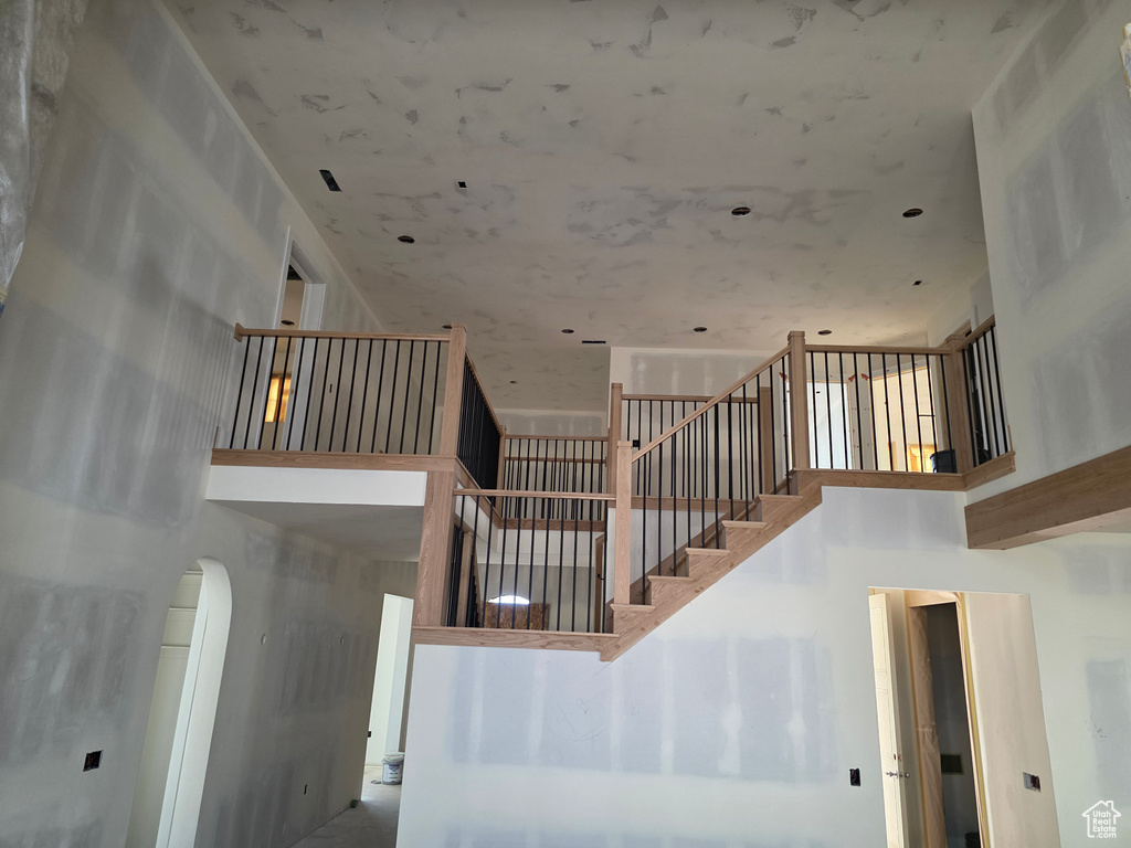 Stairway with a high ceiling and arched walkways