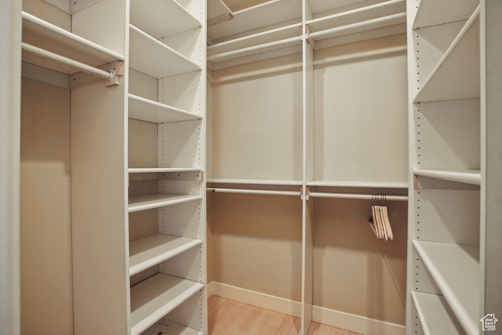 Spacious closet with wood finished floors