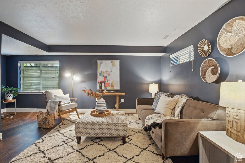 Living room with wood finished floors and baseboards