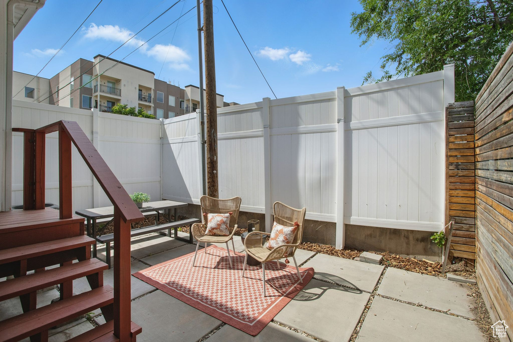 Fenced backyard with a patio and outdoor dining area