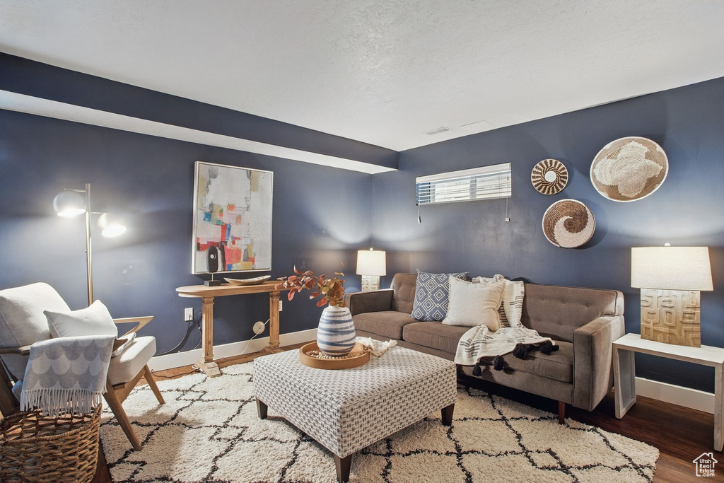 Living room with baseboards and wood finished floors