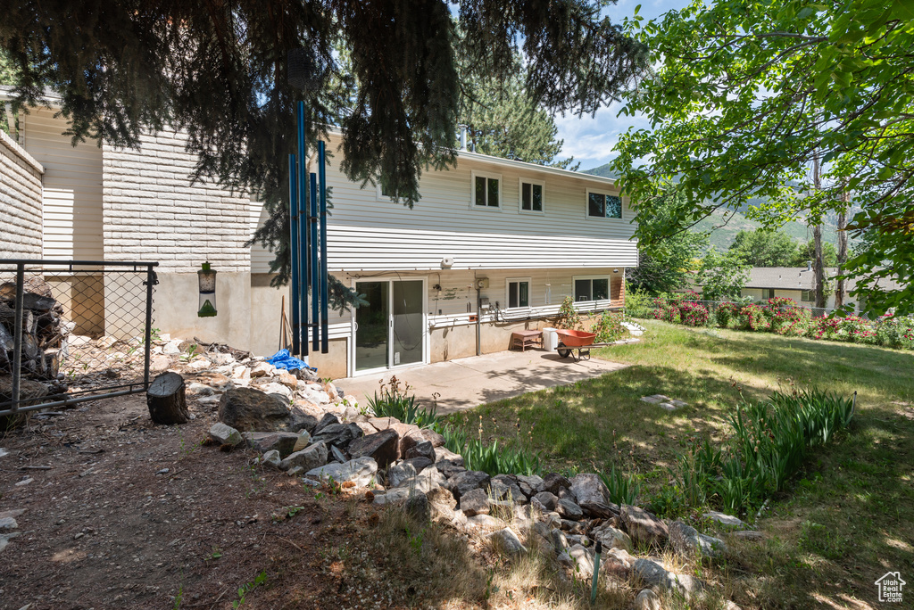 Back of property with a patio area