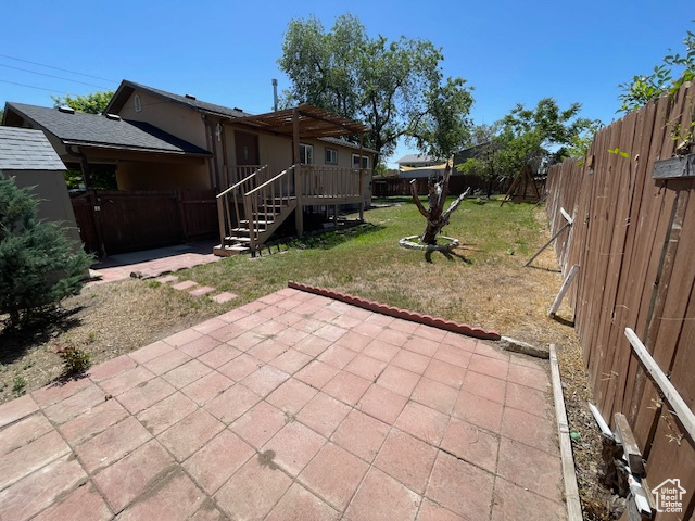 View of patio / terrace with a deck and stairway