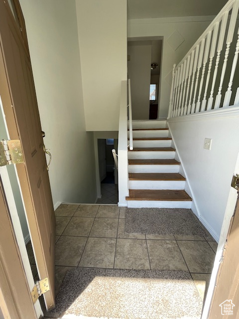 Stairway featuring tile patterned flooring