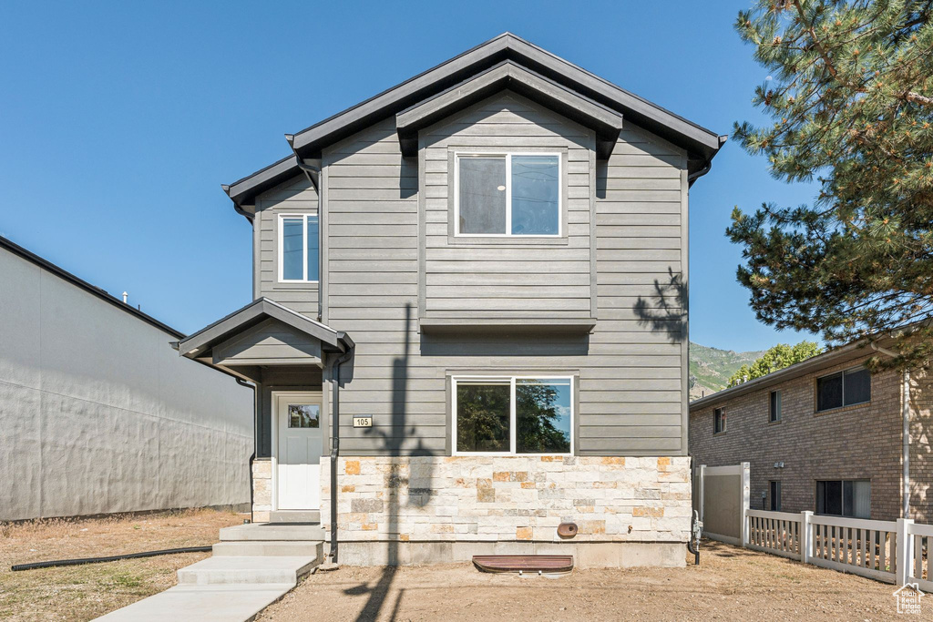 View of front of house featuring stone siding