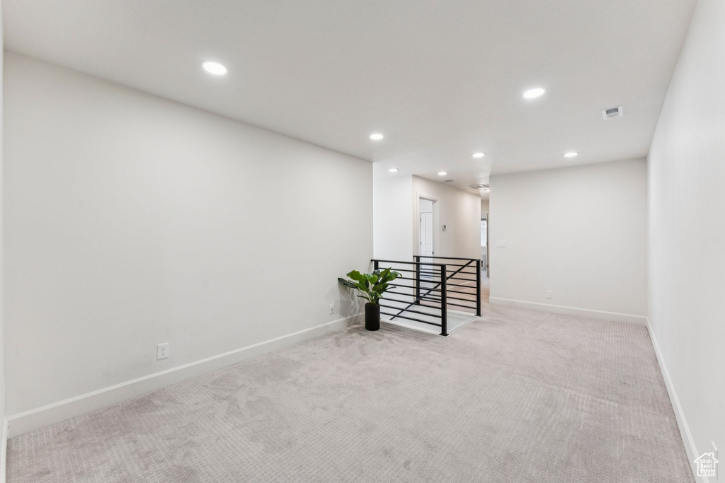 Empty room with recessed lighting, carpet flooring, and baseboards