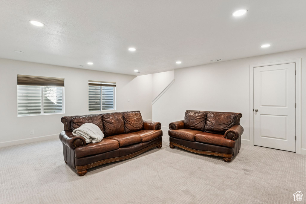 Living area featuring carpet, recessed lighting, and baseboards