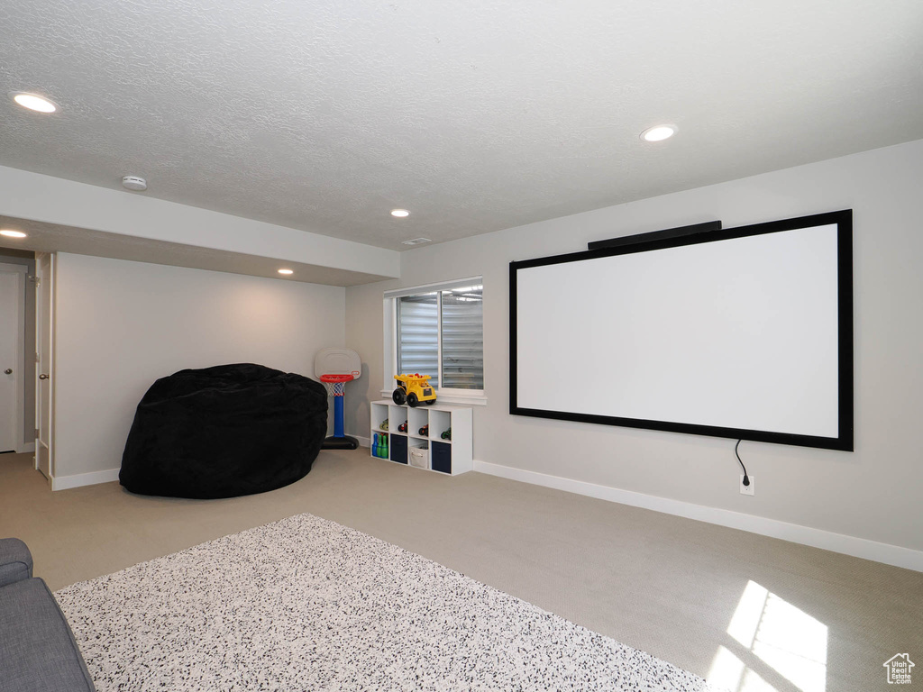 Home theater with recessed lighting and baseboards