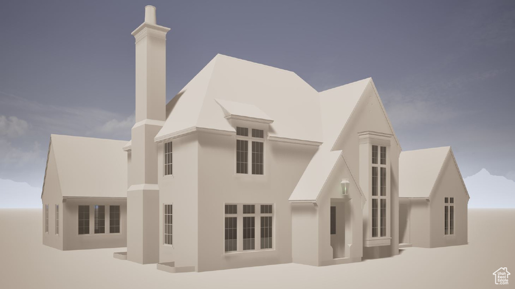 View of front of home with stucco siding and a chimney