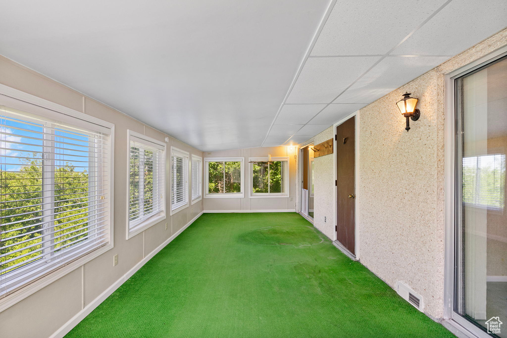 Unfurnished sunroom featuring carpet floors