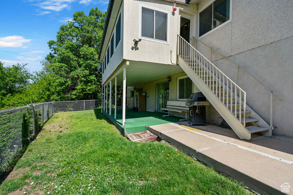 Exterior space featuring stairway and a patio area