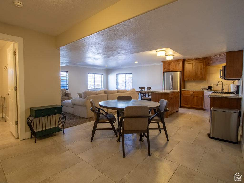 Dining room with light tile patterned floors