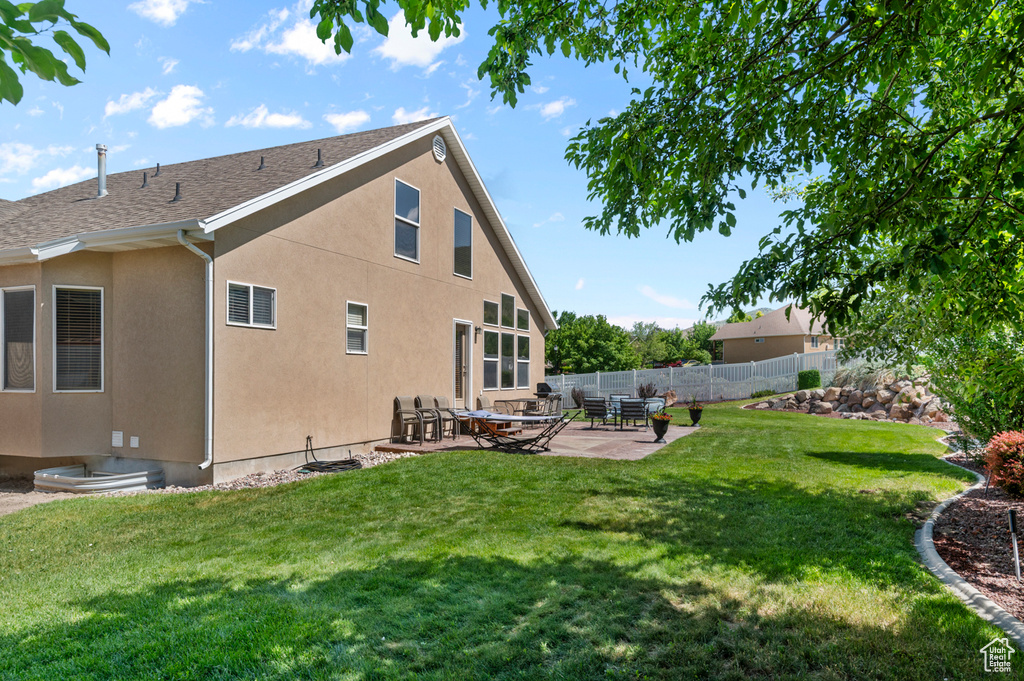 Back of house featuring a patio and stucco siding