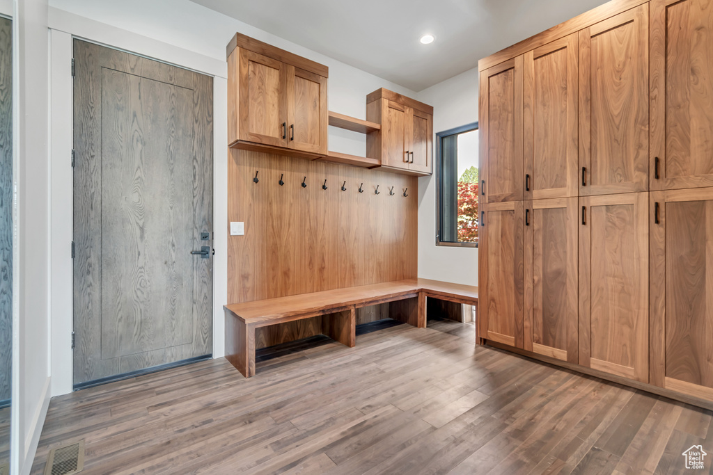 Mudroom featuring wood finished floors and recessed lighting
