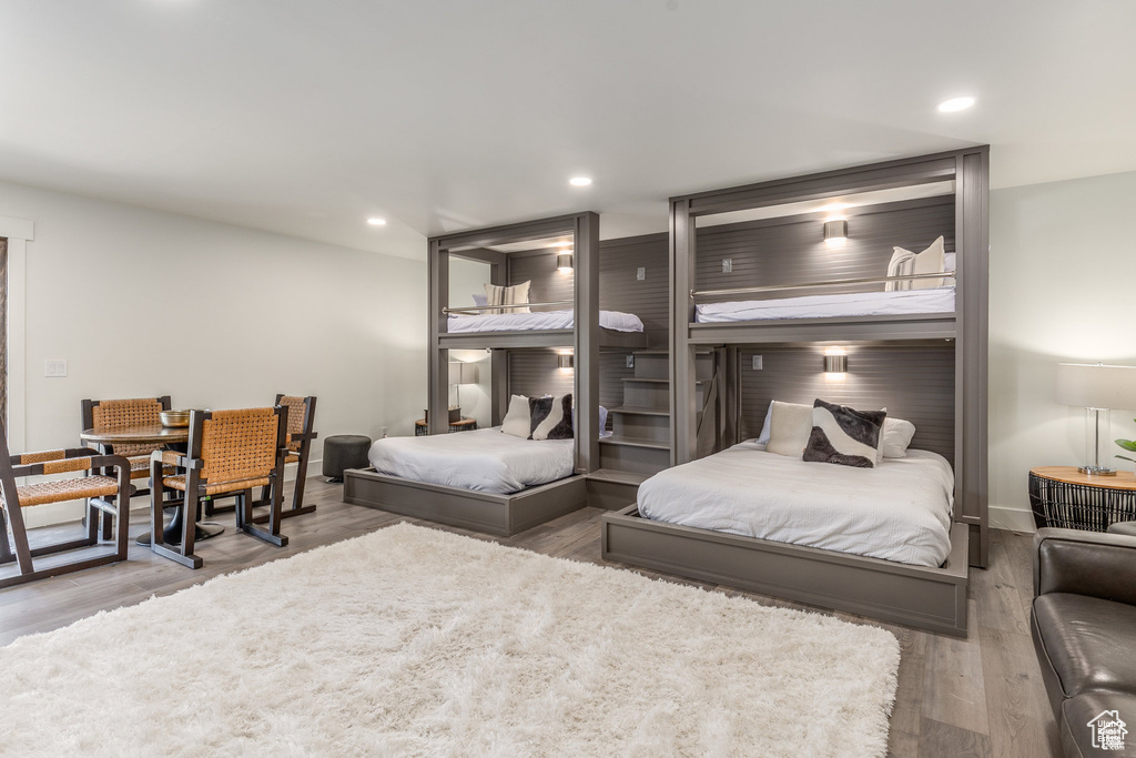 Bedroom with wood finished floors and recessed lighting