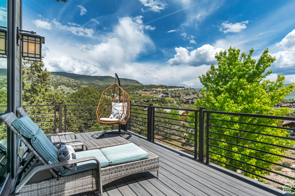 Wooden deck featuring a mountain view