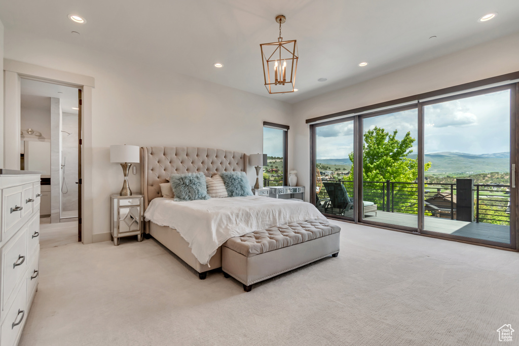 Bedroom with access to outside, light colored carpet, a chandelier, recessed lighting, and baseboards