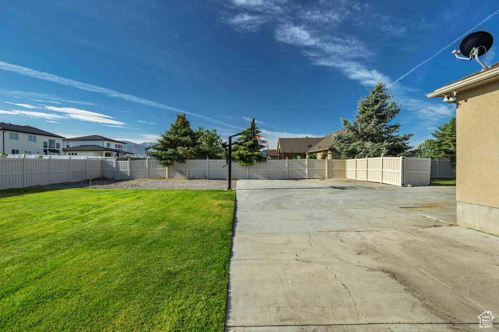 View of yard featuring a patio and a residential view