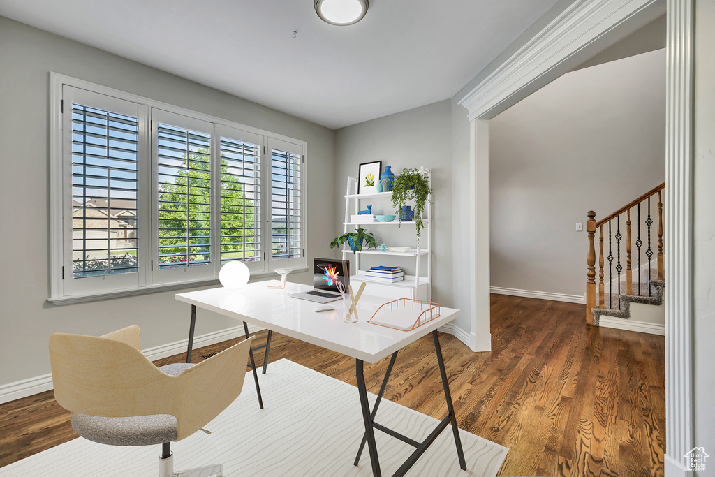 Office featuring baseboards and wood finished floors