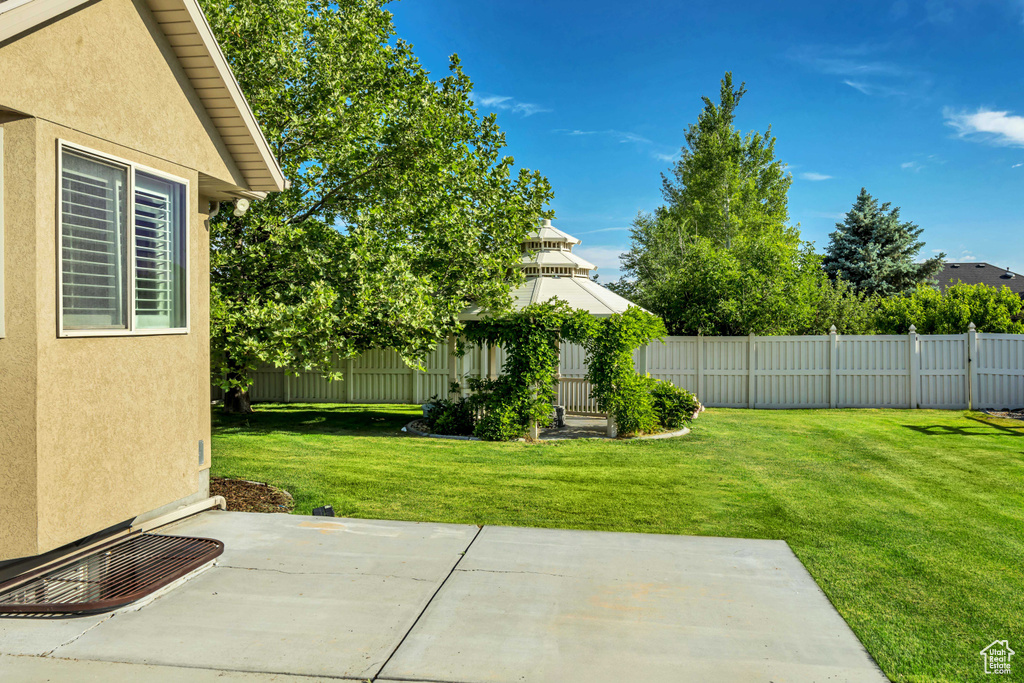 View of yard with a patio area