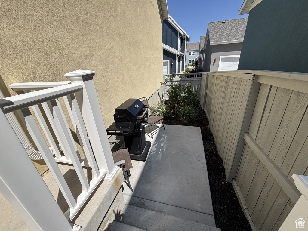 View of patio / terrace featuring area for grilling and a residential view