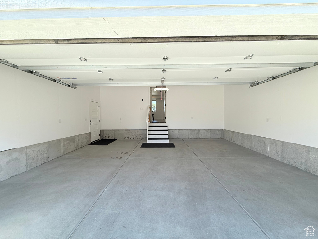Garage featuring a garage door opener