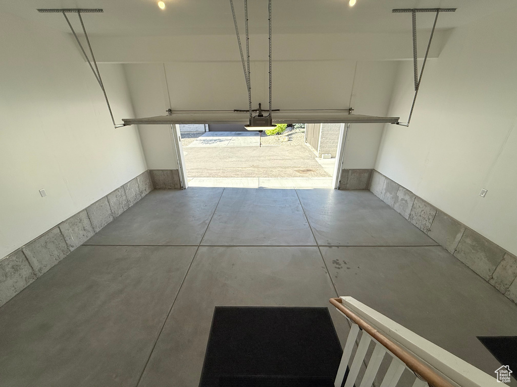 Garage featuring a garage door opener