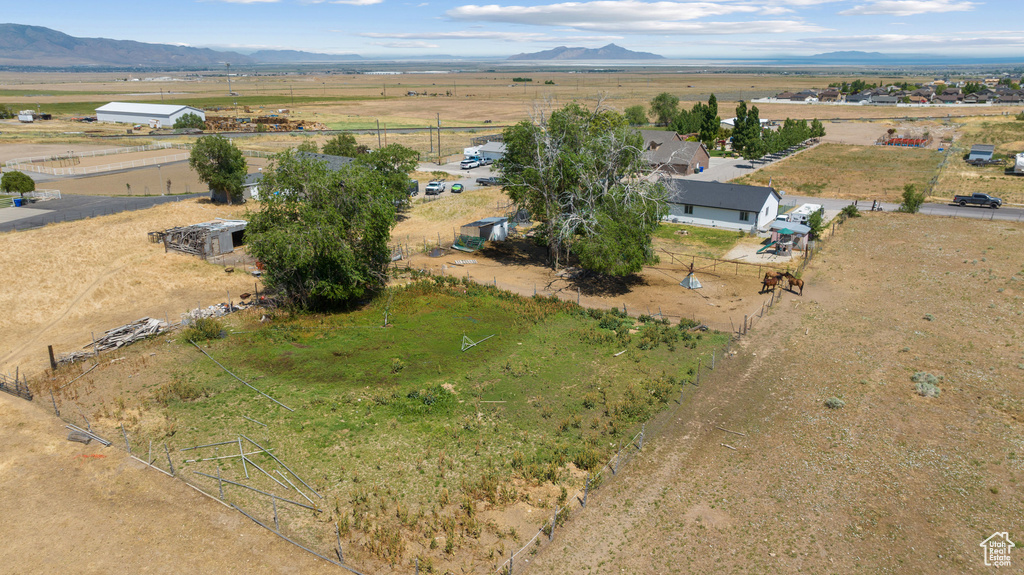 Aerial view of sparsely populated area with a mountainous background