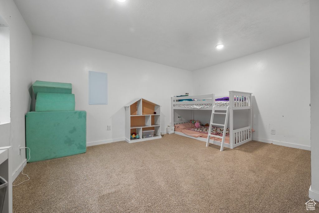 Carpeted bedroom featuring baseboards and recessed lighting