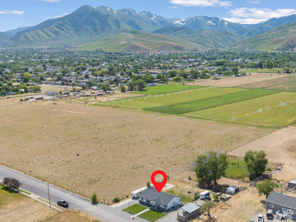 Aerial view of sparsely populated area with a mountainous background