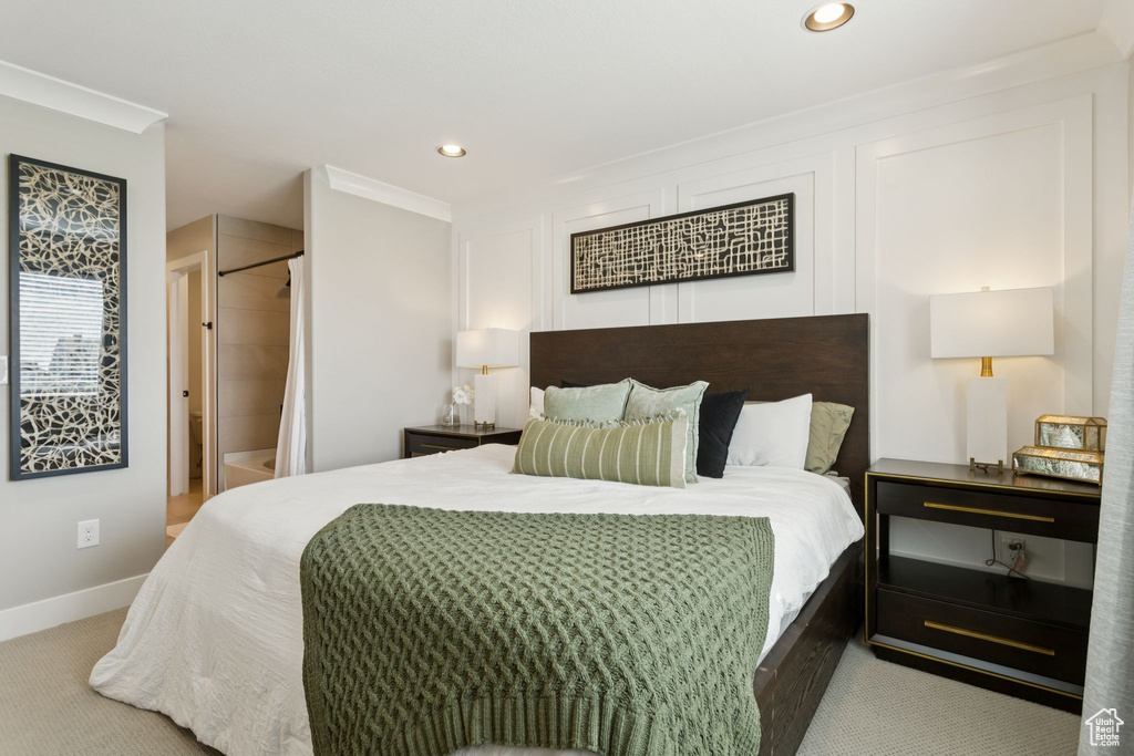 Carpeted bedroom with recessed lighting, baseboards, and crown molding