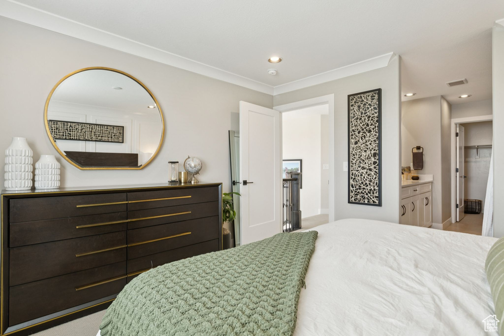 Bedroom with recessed lighting, crown molding, and baseboards