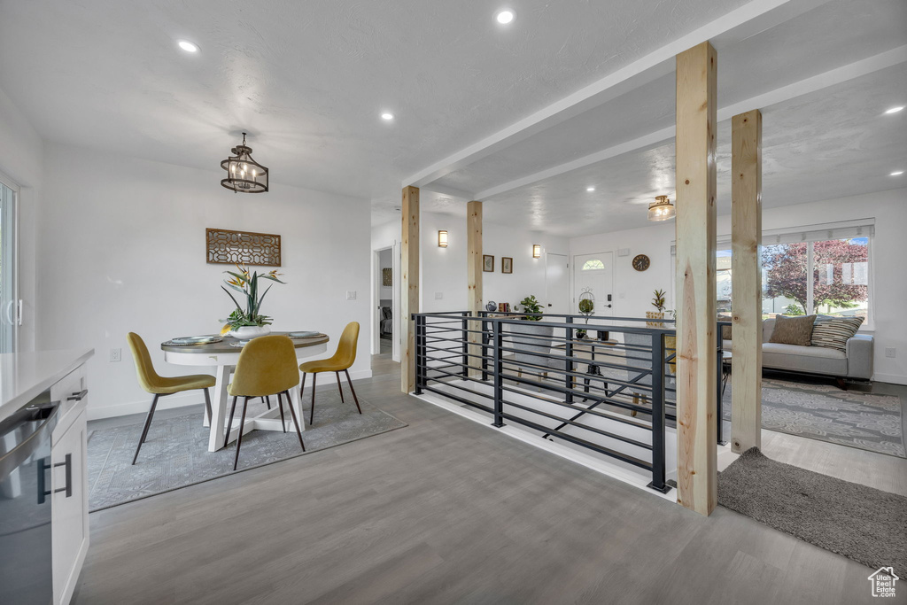 Dining space with recessed lighting, wood finished floors, and baseboards
