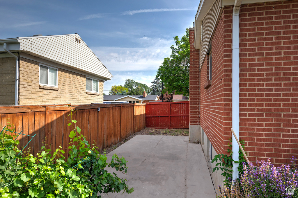 Fenced backyard with a patio