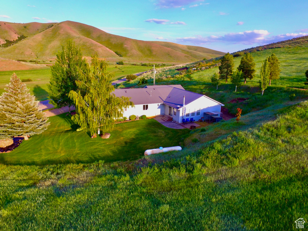 View of subject property with mountains