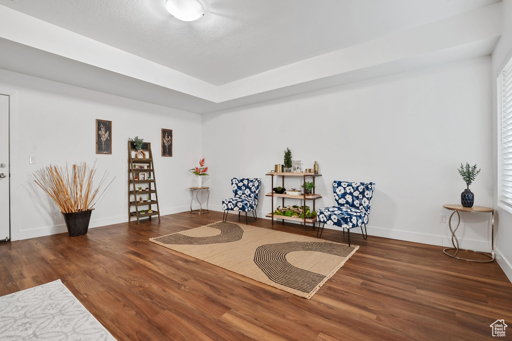 Sitting room featuring wood finished floors and baseboards