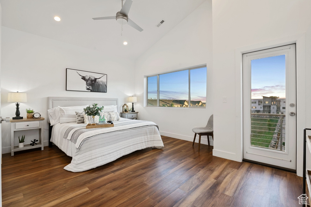 Bedroom with access to exterior, recessed lighting, wood finished floors, high vaulted ceiling, and baseboards