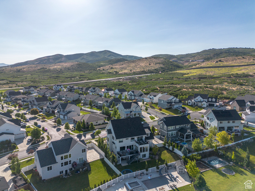 Aerial perspective of suburban area with a mountain backdrop