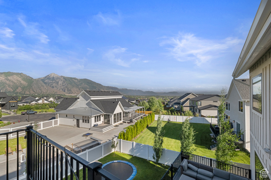 Balcony with a residential view and a mountain view