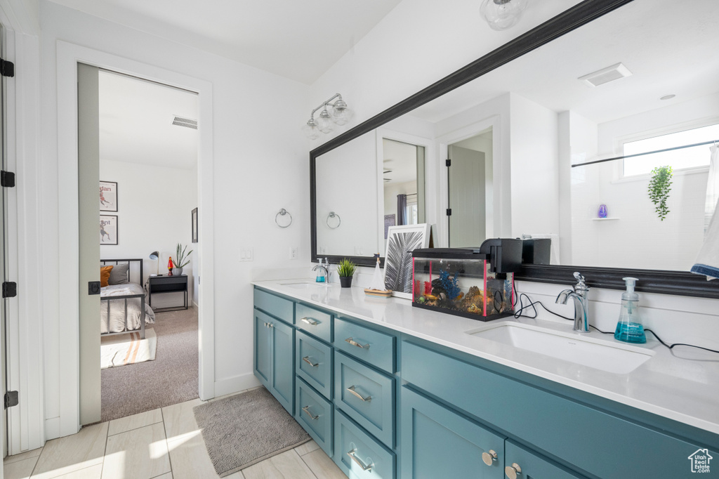 Ensuite bathroom featuring double vanity