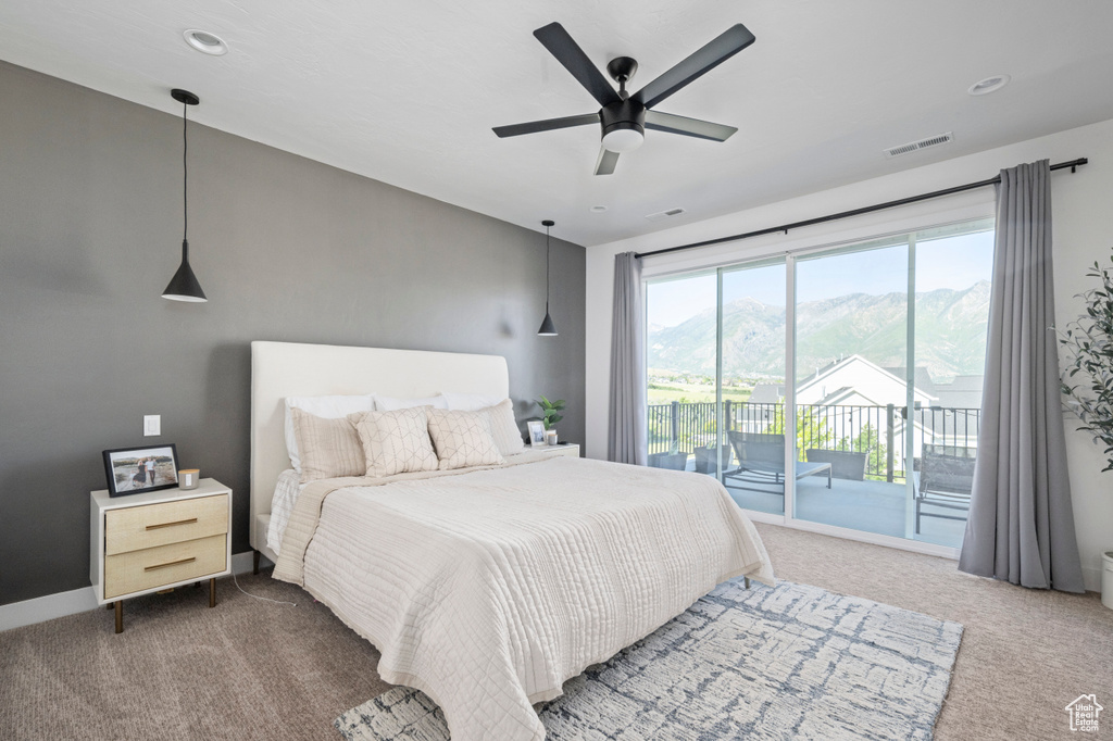 Carpeted bedroom with access to outside, a ceiling fan, a mountain view, baseboards, and recessed lighting