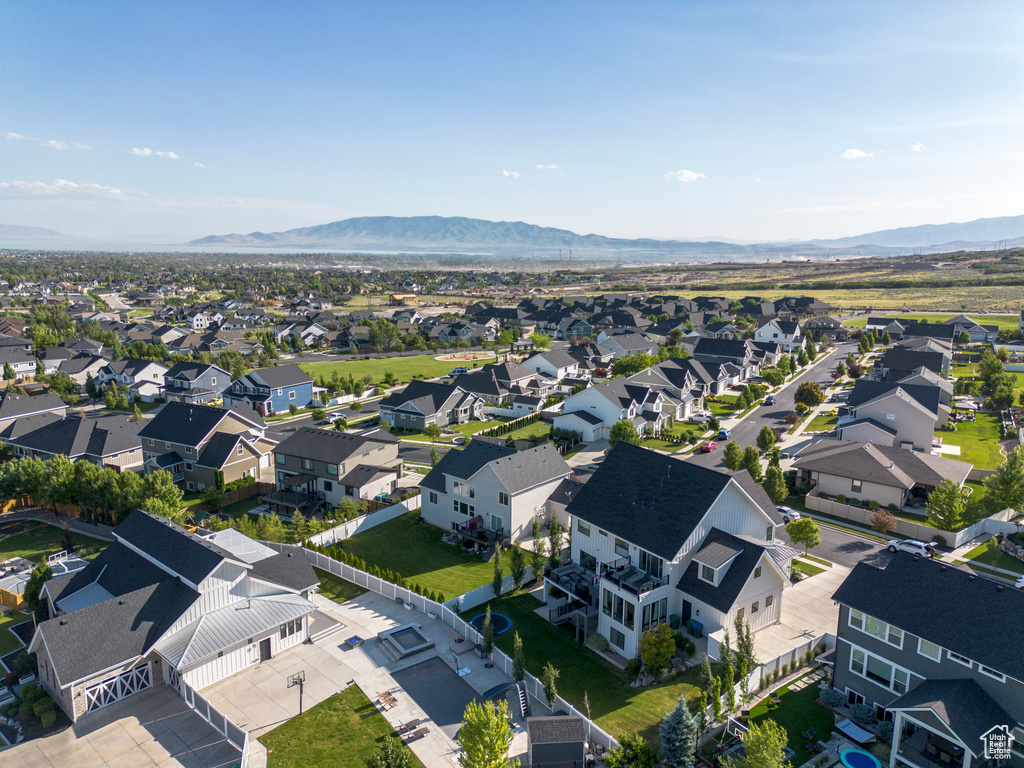 Aerial perspective of suburban area with a mountainous background