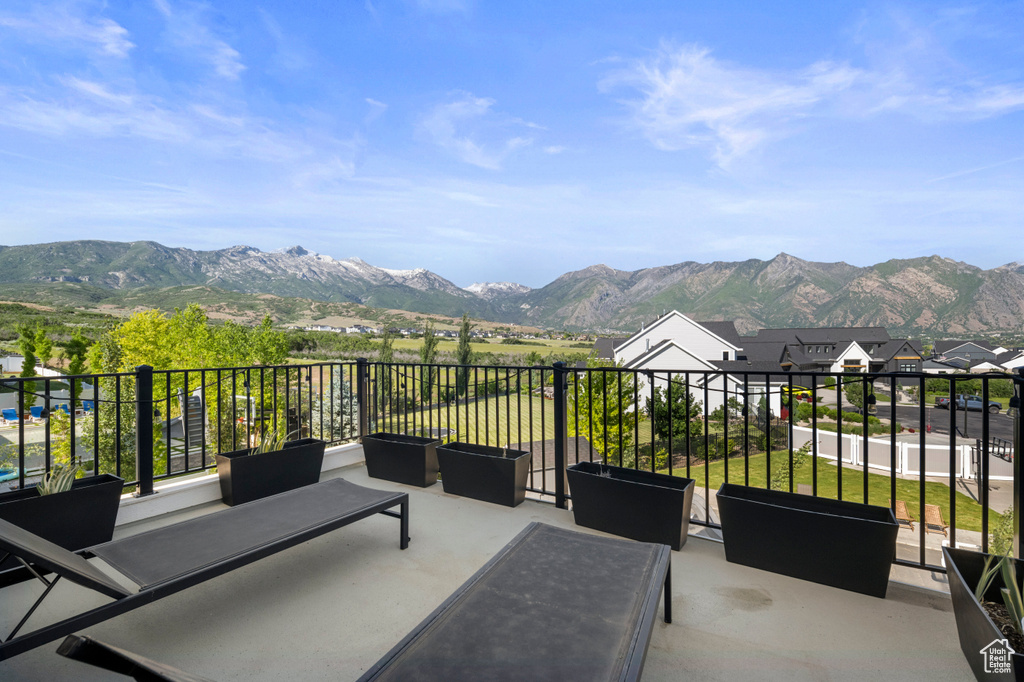 View of patio / terrace featuring a mountain view and a balcony