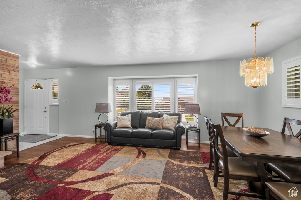 Living area featuring wood finished floors, plenty of natural light, and baseboards