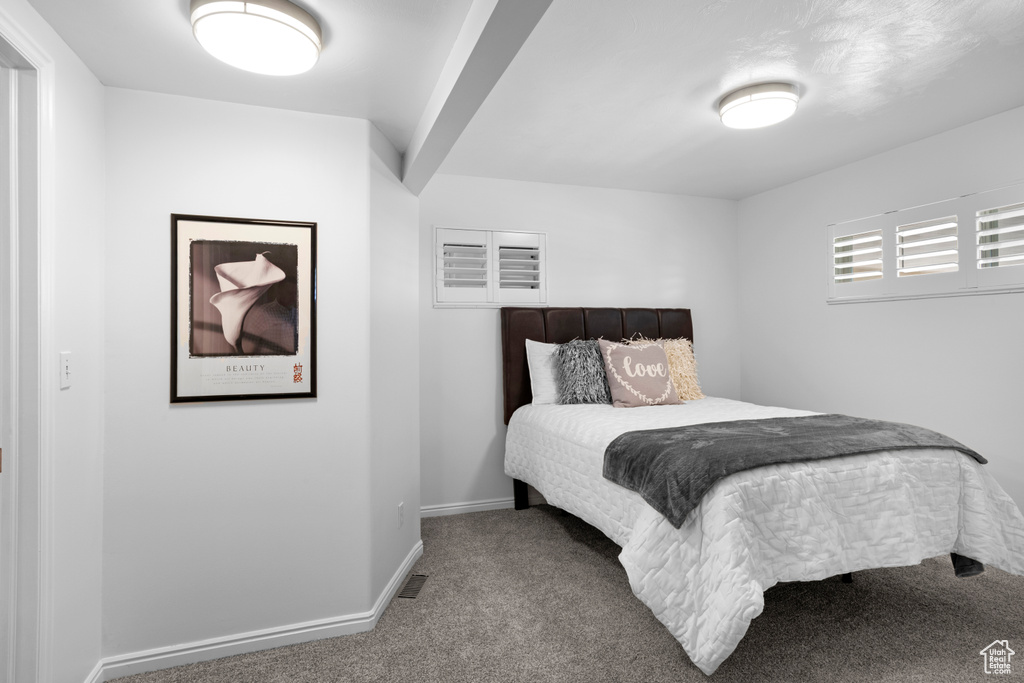 Carpeted bedroom with baseboards