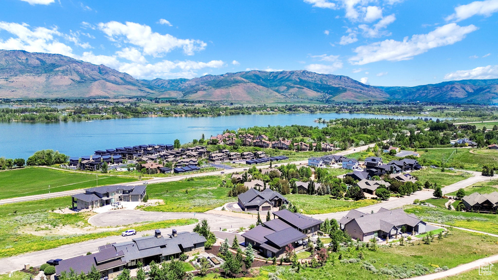 Aerial perspective of suburban area featuring a water and mountain view
