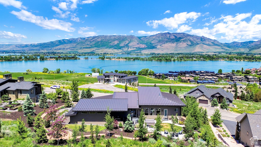 Aerial perspective of suburban area with a water and mountain view