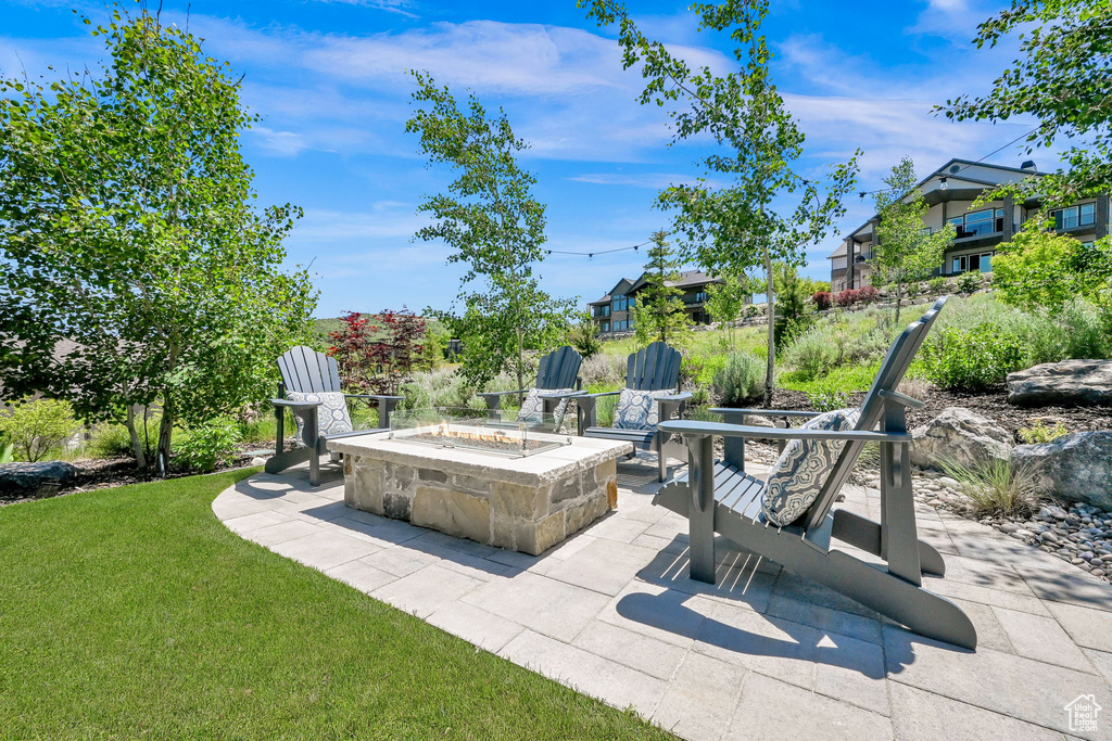 View of patio / terrace with a fire pit